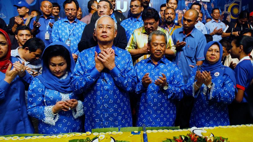 Malaysia's Prime Minister and Barisan Nasional (BN) chairman Najib Razak (2nd L) celebrates his victory with a prayer on election day at the PWTC on May 5, 2013 in Kuala Lumpur, Malaysia.