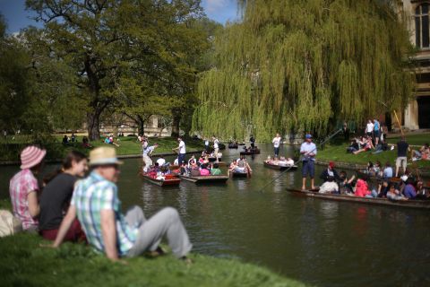 People soak up the spring sunshine on the River Cam on Monday, May 6, in Cambridge, England.