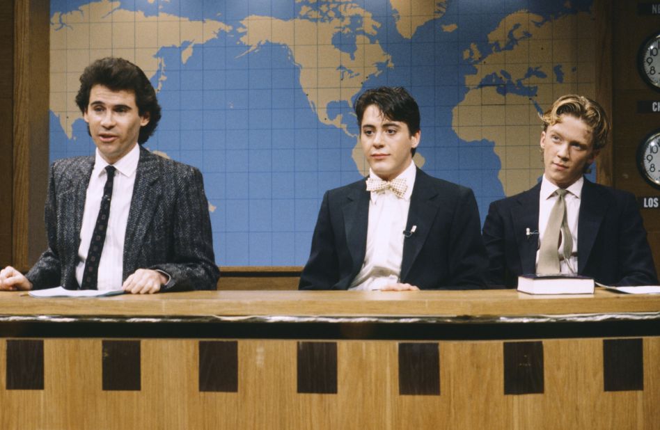 Downey joined 'Saturday Night Live's" cast for a season. From left, Dennis Miller, Downey and Anthony Michael Hall act out a "Weekend Update" on April 14, 1986.