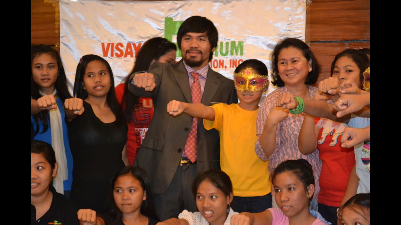 Manny Pacquaio, with Oebanda, meets girls rescued from human traffickers. The girls shared their stories with Pacquaio, who also spoke at congress in support of an anti-trafficking law.