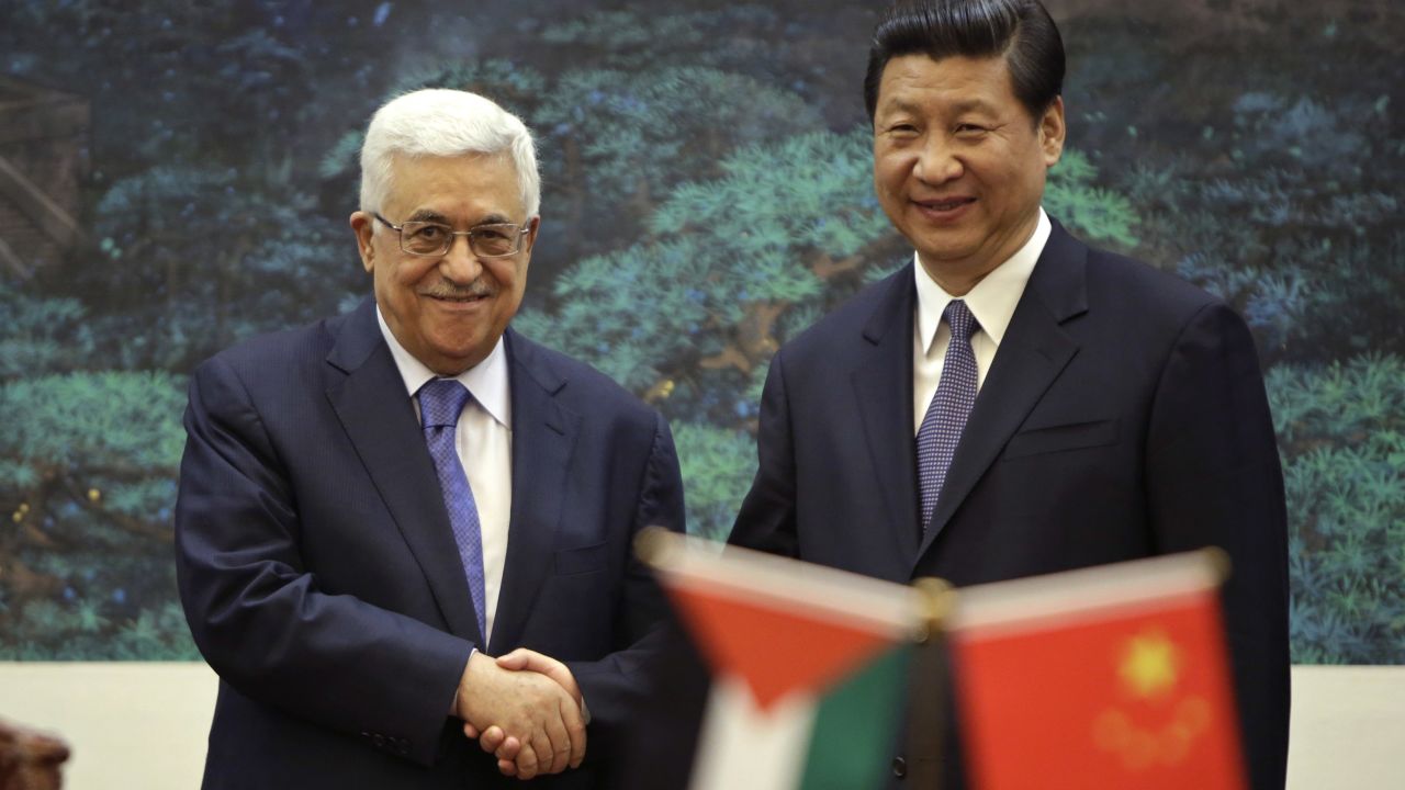 Palestinian Authority President Mahmoud Abbas shakes hands with Chinese President Xi Jinping on May 6, 2013.