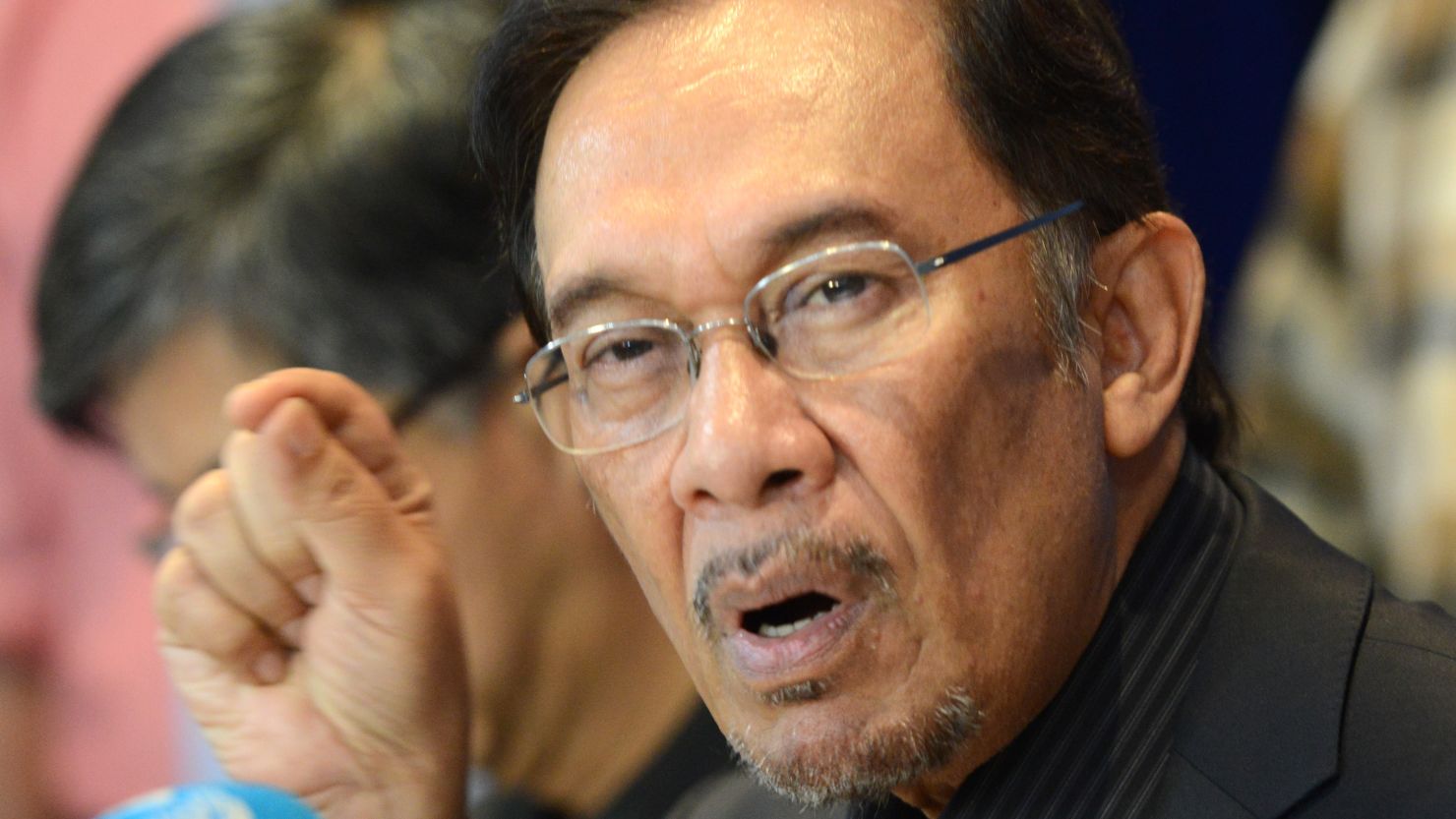 Opposition leader Anwar Ibrahim answers a question during a press conference at his party head office on May 7, 2013.