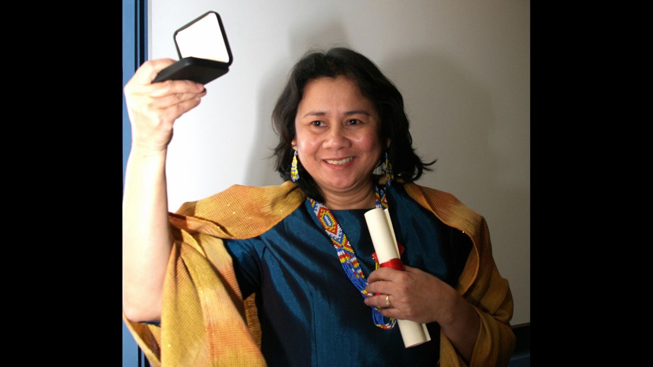 Oebanda receives the 2005 Anti-Slavery Award at Chatham House in London on November 29, 2005. The award was presented by Lord Bill Brett, director of the International Labour Organization.