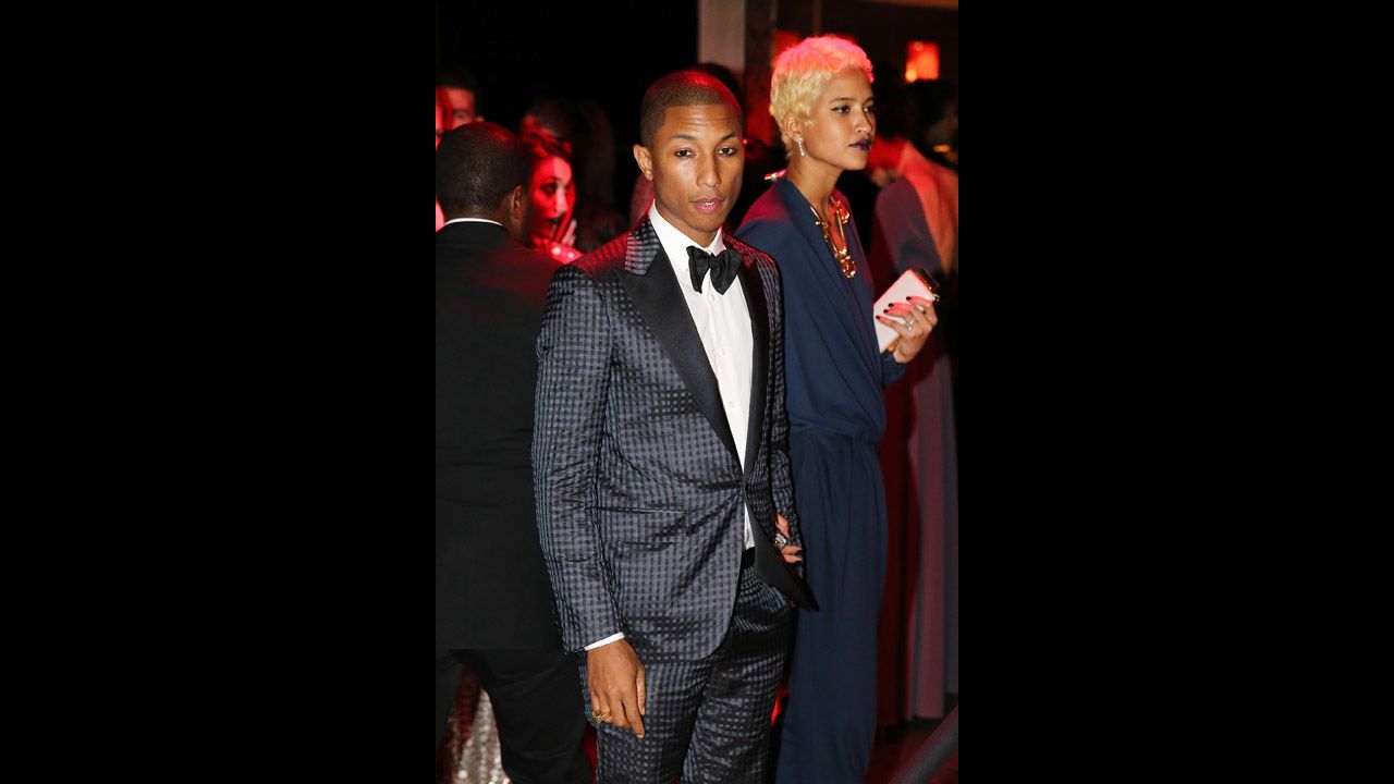 Musician Pharrell Williams and designer Helen Lasichanh attend the gala.