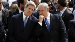 Israeli Prime Minister Benjamin Netanyahu, right, speaks with U.S. Secretary of State John Kerry during the annual ceremony for the Holocaust Remembrance day at the Yad Vashem memorial on April 8, 2013, in Jerusalem.
