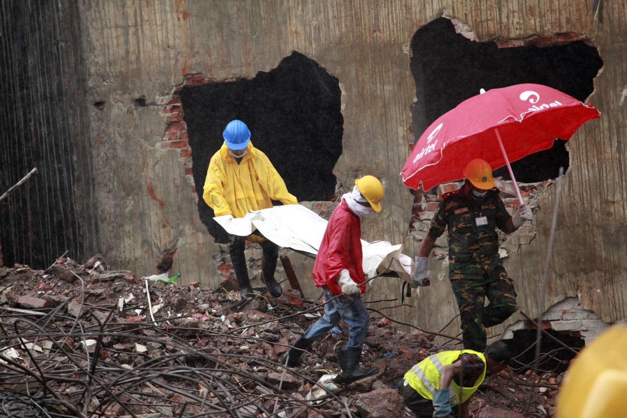 Rescue workers recover a body from the rubble on May 7.