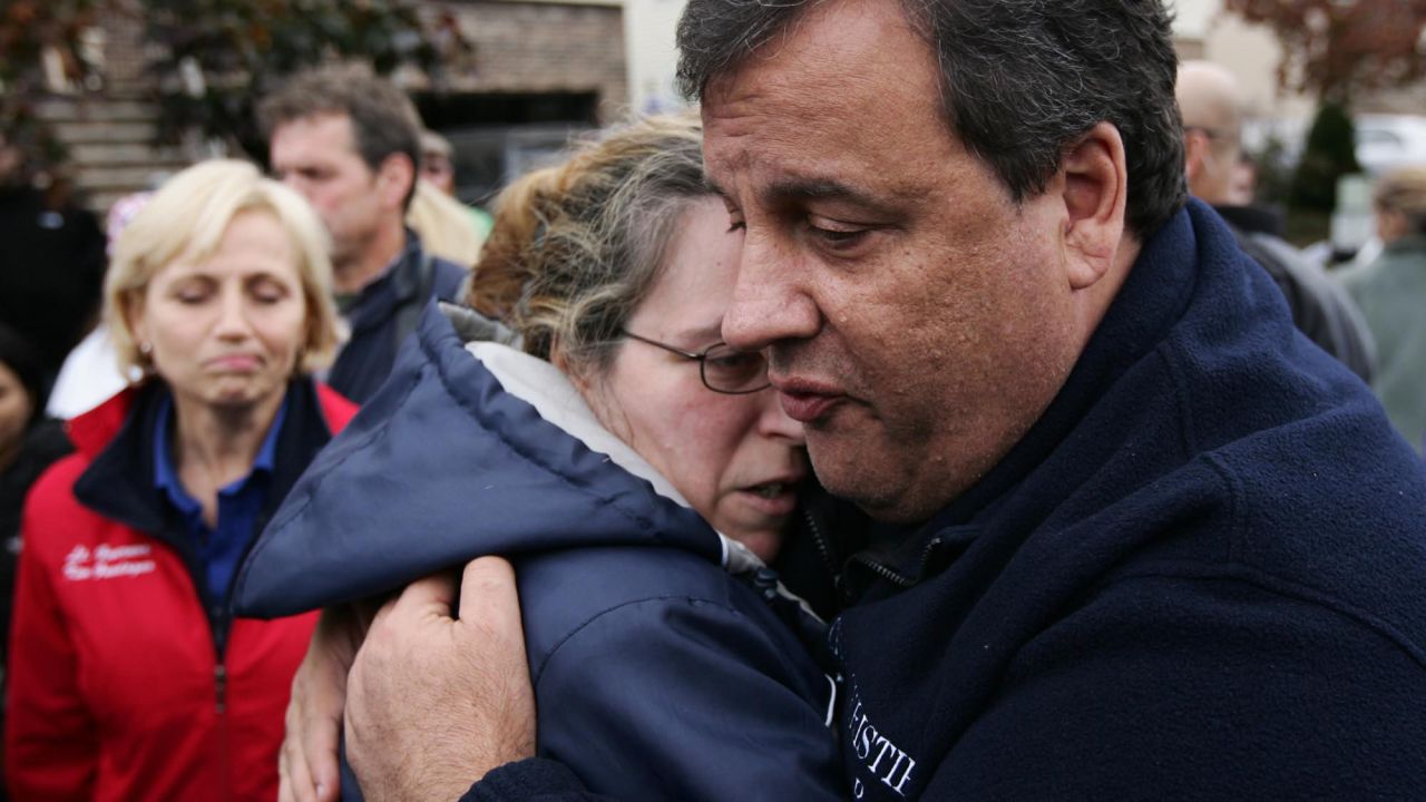 Christie tries to comfort Alice Cimillo, whose home was damaged by Superstorm Sandy, on November 1, 2012, in Moonachie, New Jersey.