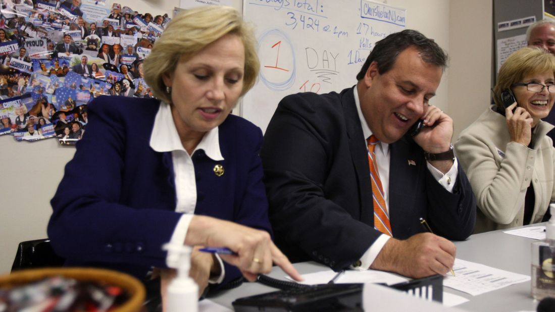 Christie and his running mate, Sheriff Kim Guadagno, left, make phone calls to voters at Monmouth County Republican Headquarters on November 2, 2009, in Freehold, New Jersey.