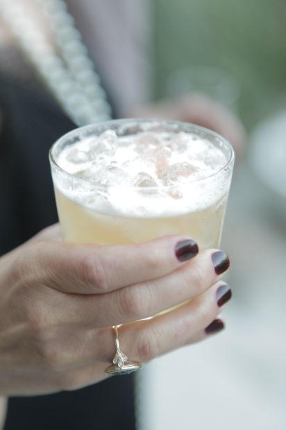 Period-appropriate drinks are a must at a 1920s party. Los Angeles event planner Amy Campbell recommends a gin fizz or a penicillin. She also suggests <a href="http://ireport.cnn.com/docs/DOC-969063">hinting at the Prohibition era</a> by covering liquor bottles at the bar with brown paper bags.