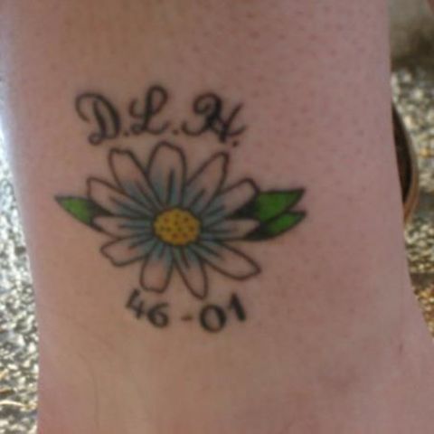 Joanne Asbury wanted a tattoo to remember and celebrate her mom after she died in 2001. She decided on an <a href="http://ireport.cnn.com/docs/DOC-966275">image of a daisy</a>, since that was her mom's favorite flower. "I put her tattoo on my ankle, so she is with me every step I take," said Asbury.