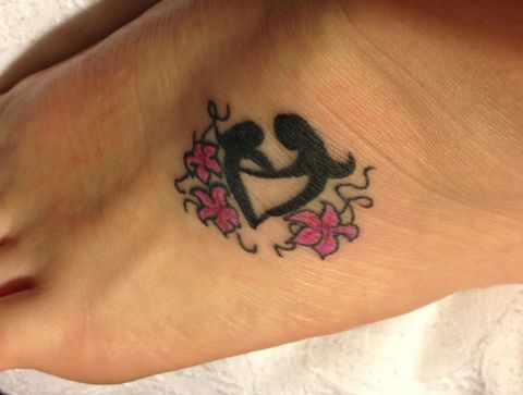 Amanda Clifton and her mom have matching tattoos on their feet of a <a href="http://ireport.cnn.com/docs/DOC-966755">mother and daughter</a> forming a heart. They had talked about the idea for a while, and finally decided to make it a reality during a mother/daughter vacation in Florida. "My mom is my BFF," said Clifton. "When you have so much love for a person, it's hard not to show some love with ink." She says she gets lots of compliments on the tattoo and that people frequently remark they "want to do the same thing with their own moms."