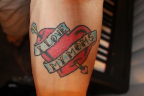 Kyle Divine <a href="http://ireport.cnn.com/docs/DOC-967247">honors both his moms</a> with a tattoo he got on his arm on Mother's Day in 2006. "My moms were the best role models I had while I was growing up, regardless of sexual orientation," he said. "I got the tattoo to show them and the world that I am proud to have them as my parents." It also has a more subtle meaning: "Without actually saying it, the tattoo says that I am a supporter of gay rights." Divine says both his moms love the ink.