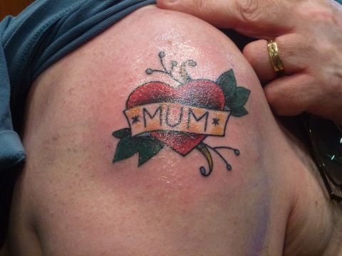 John Clarke got his "mum" tattoo -- his first and only -- on his shoulder <a href="http://ireport.cnn.com/docs/DOC-967264">at age 50</a>. He revealed it to his mother at her 70th birthday party, despite knowing that she hated tattoos. "Now, many thousands of miles away from home, every time I see the tattoo in the mirror, I can smile about that evening and my mum's shocked expression," he said.