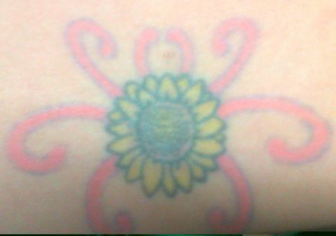 Maranda Green's mother passed away from complications of <a href="http://ireport.cnn.com/docs/DOC-966677">polycystic kidney disease</a> when she was just 14. At 19, Green was diagnosed with the same condition. The meaning of her sunflower tattoo is twofold: It's in memory of her mom, and it's a symbol of her own resolve in fighting the disease. Why a sunflower? "My mom always loved those big, seemingly flowing fields of sunflowers," said Green. The tattoo is, of course, on her lower back -- over the kidneys.