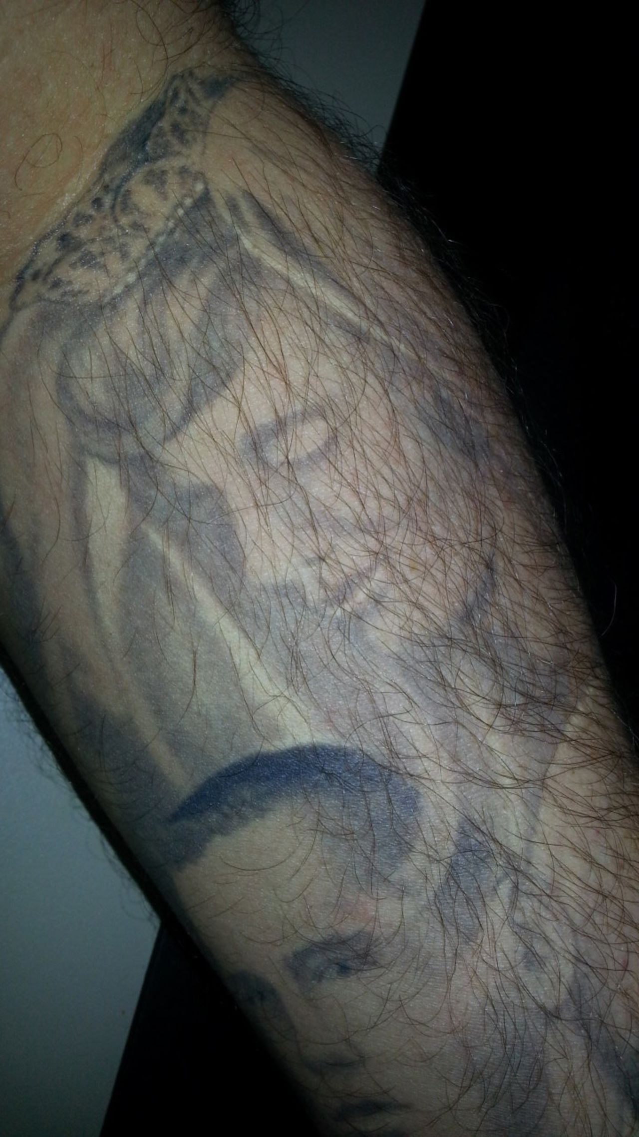 Brad Allison paid tribute to his parents by <a href="http://ireport.cnn.com/docs/DOC-966653">inking their portraits</a> on his forearm. He chose a wedding photograph of his mother and his father's senior picture, and the tattoo artist combined them to create the final design. When Allison got his first tattoo -- he has seven -- his mom "had a fit." But when he got this one, his third, he says she cried. The tattoo is especially precious to Allison because his father died five years ago, and "it looks as if my mother is watching over him."