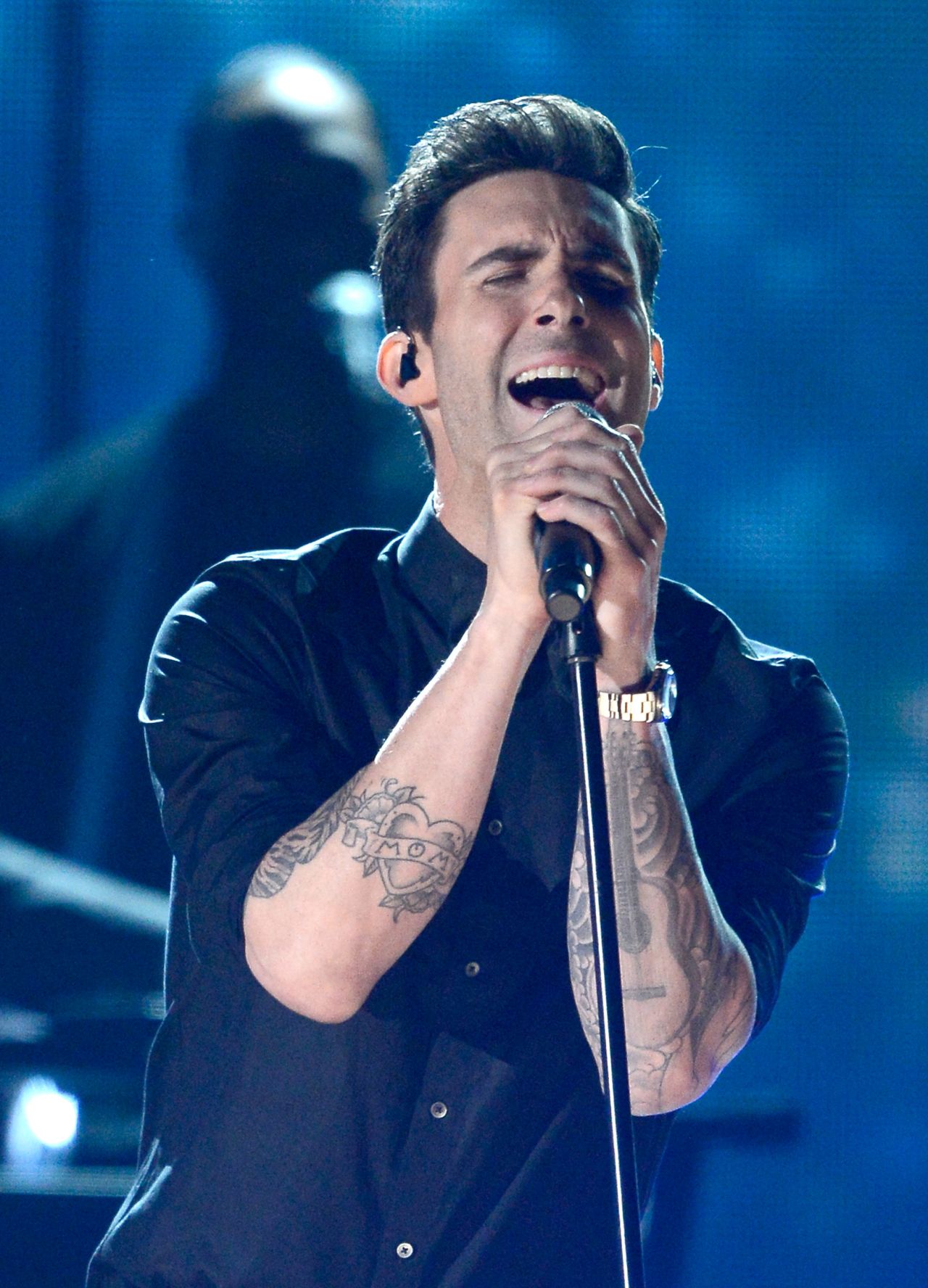 Levine's mom tattoo near his elbow.