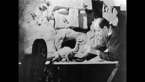 Harryhausen works with a figure of a dinosaur for an unidentified film.
