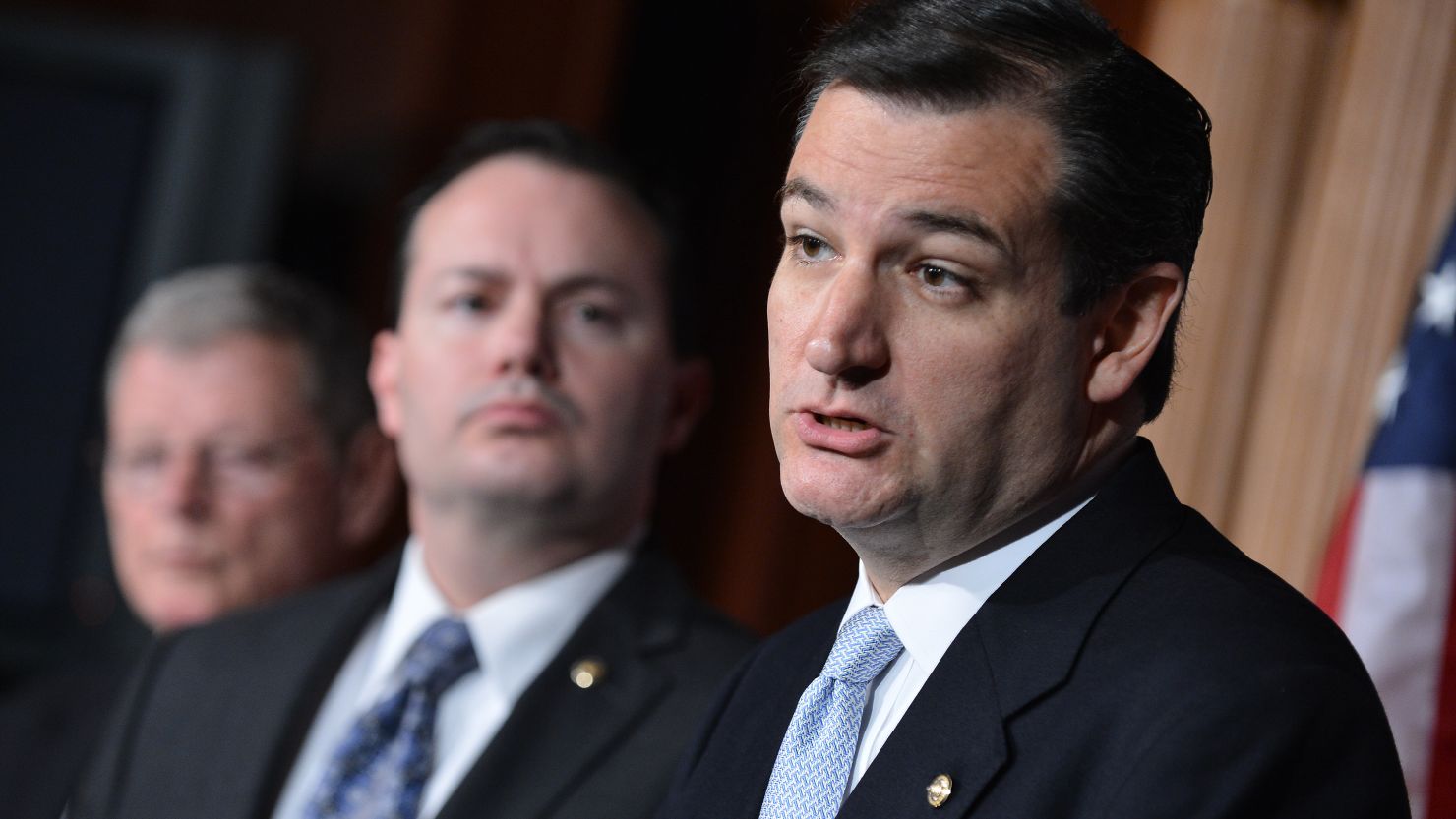  Sen. Ted Cruz, right, urges the defunding of President Obama's health care act as Sen. Mike Lee watches on March 13.
