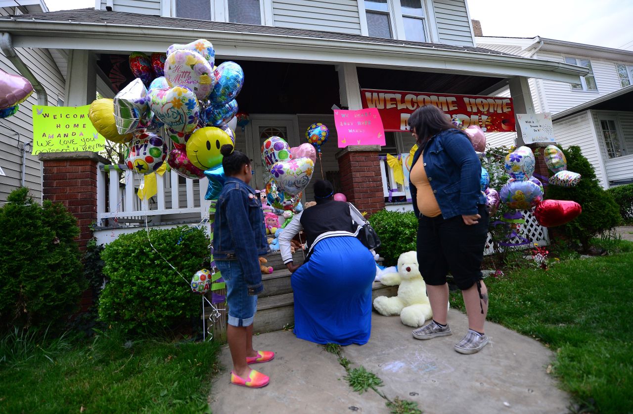Well-wishers visit the home of the sister of Amanda Berry on Monday, May 6.