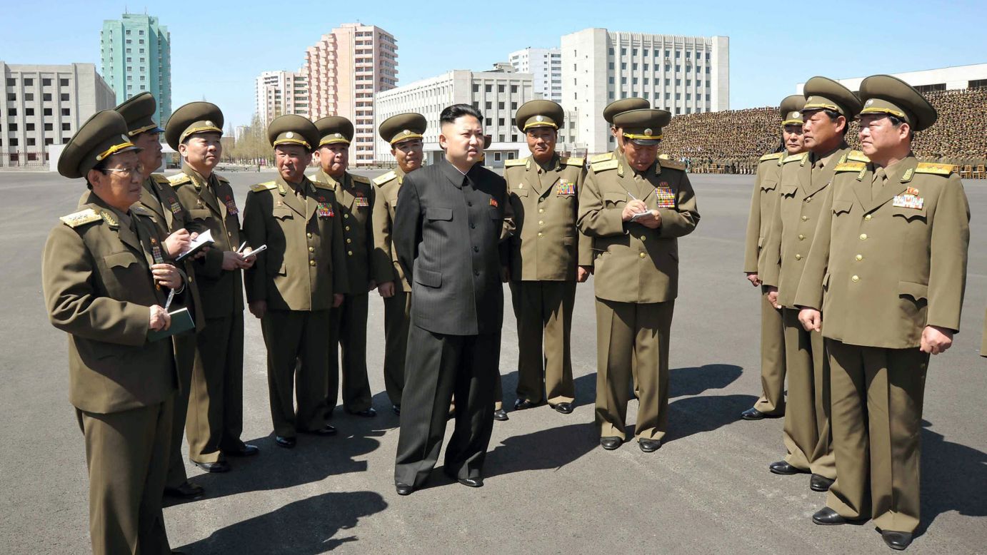Kim visits the Ministry of People's Security in 2013 as part of the country's May Day celebrations.