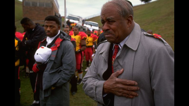 Eddie Robinson served as Grambling State University's head football coach for 57 seasons from 1941 to 1997. Robinson -- here listening to the national anthem before his final game -- coached more than 4,000 players. 
