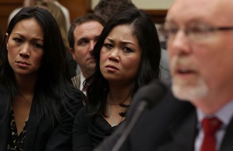 Dorothy Narvaez-Woods, center, listens as Hicks testifies. She is the widow of Navy SEAL Tyrone Woods, who was killed in the attack.