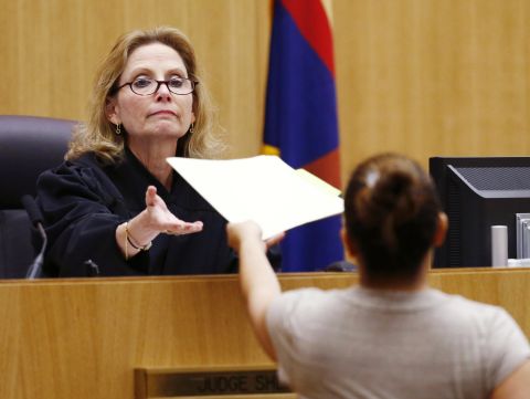 Judge Sherry Stephens receives the jury's decision in May. The jury had been in court since January 2. Jurors deliberated for 15 hours and five minutes before finding her guilty of first-degree murder.