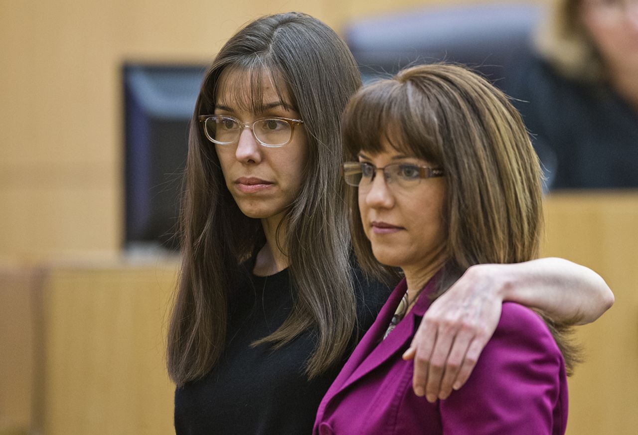 Arias puts her arm around defense attorney Jennifer Willmott after being asked to demonstrate how she had her arm around her sister in a photograph that had been admitted into evidence. Willmott has said Arias was the <a href="http://www.hlntv4u.com/article/2013/01/04/jodi-arias-trial-week-1-highlights" target="_blank" target="_blank">victim of a controlling, psychologically abusive relationship</a> and that Alexander considered Arias "his dirty little secret."