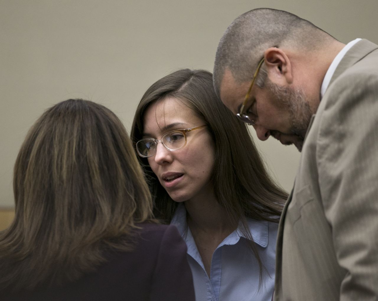 Arias talks to defense attorneys Willmott, left, and Kirk Nurmi during her trial on April 3, 2013. Arguing the prosecution's position that Arias was obsessed with Alexander and stalking him, Nurmi said it didn't add up because Arias was active on a Mormon dating site. "Jodi ... wasn't so locked in on Travis that she wasn't looking for other men," Nurmi said.