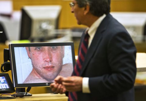 On February 28, 2013, prosecutor Juan Martinez asks Arias about a photograph she took of Alexander in the shower moments before he was killed. Prior to Alexander's killing, Martinez said, Arias stole her grandparents' .25-caliber pistol, rented a car in Redding, California, turned off her cell phone and brought along cans of gas so there would be no record that she was in Arizona.