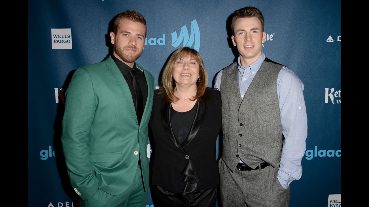 Scott Evans, left, and Chris Evans with their mother, Lisa Evans.