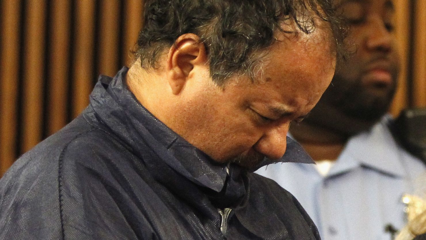 Ariel Castro stands with his head down during his arraignment on kidnapping and rape charges on May 9 in Cleveland, Ohio.