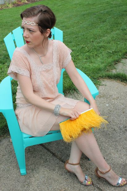J.Crew personal stylist Caitlin Riley <a href="http://ireport.cnn.com/docs/DOC-969068">put together a 1920s look</a> with a faux bob hairstyle, deep red lipstick, art deco accessories and a yellow feather clutch. Riley blogs about fashion with her twin sister, Valerie Efta.