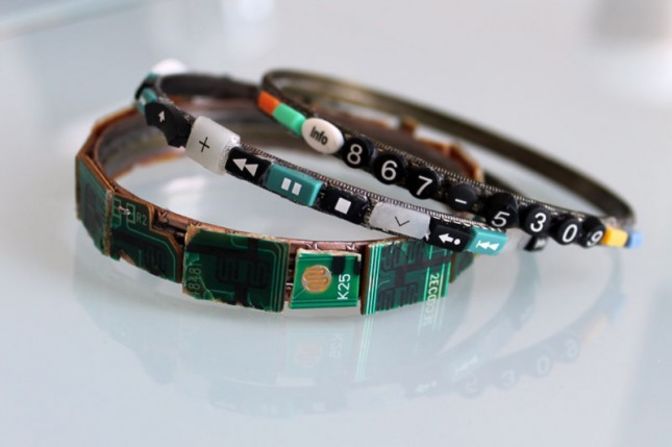 The tiny parts from the remotes have many uses. These are bracelets decorated with clipped buttons and circuit boards. The phone number on the side is 867-5309, referring to a famous song from the 1980s.
