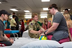 On a visit to the Walter Reed National Military Medical Center in 2013, Prince Harry met Staff Sgt. Timothy Payne, who lost his legs in an IED explosion in Afghanistan.