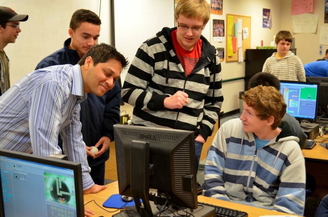 Nihar Shah, left in striped shirt, teaches a computer-science course at Liberty High School in Issaquah, Washington.