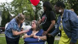 Deborah Knight, the grandmother of kidnapping victim Michelle Knight, participates in a community balloon-release service in Michelle's honor on Thursday, May 9, in Cleveland. Four females were found in a home on Seymour Avenue in the Clark Fulton neighborhood on Monday. Since then, the neighborhood and the nation have wondered how they were held captive without anyone noticing sooner.
