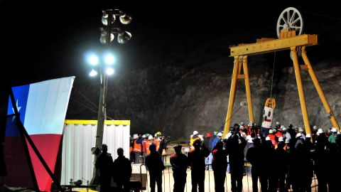 A capsule carrying a rescued miner surfaces on October 13, 2010, by the collapsed San Jose mine in Chile.