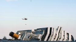 An helicopter evacuates Marrico Giempietroni, the Costa Concordia's cabin service director after he was rescued from the Costa Concordia on January 15, 2012, after the cruise ship ran aground and keeled over off the Isola del Giglio, late on January 13. Three people died and several were missing after the ship with more than 4,000 people on board ran aground sparking chaos as passengers scrambled to get off. Two South Korean honeymooners were rescued early today from the cruise as emergency crews searching for dozens missing.   AFP PHOTO / Filippo MONTEFORTE (Photo credit should read FILIPPO MONTEFORTE/AFP/Getty Images)