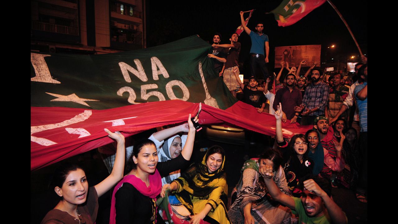 Supporters of Imran Khan shout slogans during a protest on May 12. Across the country, 29 people were killed in Election Day violence on May 11.