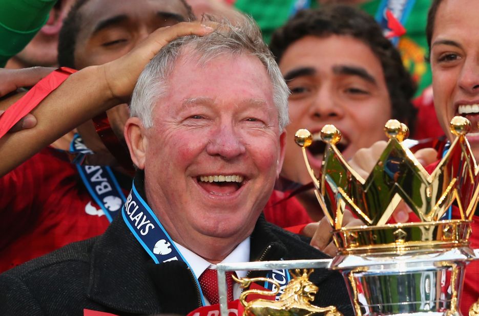 Alex Ferguson with the English Premier League trophy after Manchester United's 2-1 win over Swansea.