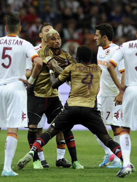 In the first half, Milan's Sulley Muntari had to be restrained by teammate Kevin-Prince Boateng after being red-carded against Roma, having bizarrely tried to pin down the arms of the referee as he tried to take out his cards. 