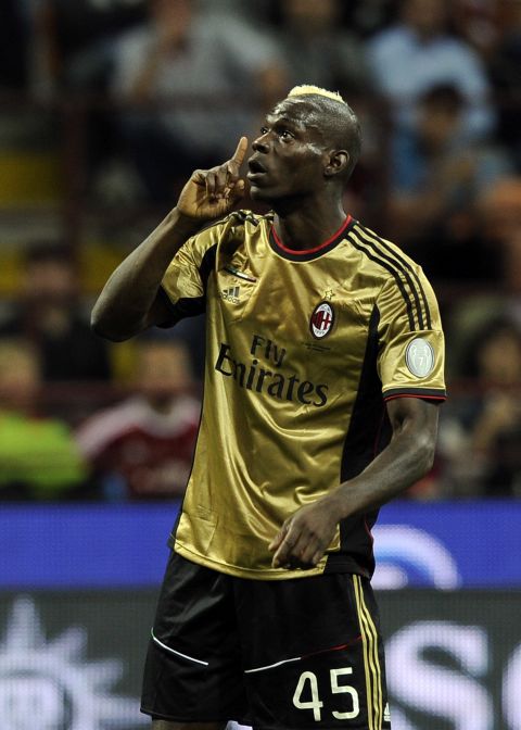 AC Milan's Mario Balotelli reacts to racist abuse from the visiting Roma fans at the San Siro on Sunday. 