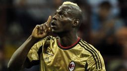 AC Milan's Mario Balotelli reacts to racist abuse from the visiting Roma fans at the San Siro in May. It was not the first time the Italian-born striker has been racially abused in Serie A.
