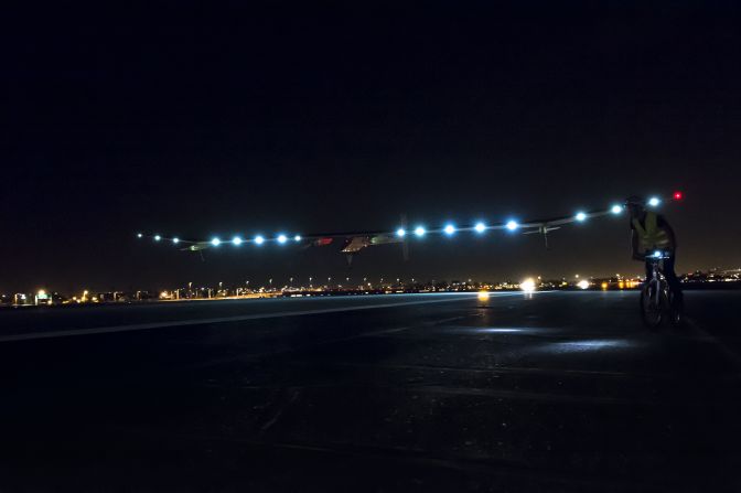 Solar Impulse, lit with more than a dozen solar-powered lights, touches down at Phoenix Sky Harbor Airport on May 3. It's the first aircraft to fly for 24 continuous hours only on sun power.
