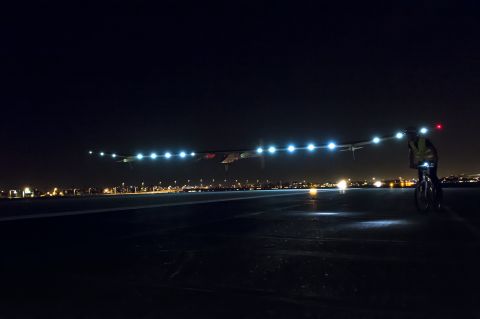 Solar Impulse, lit with more than a dozen solar-powered lights, touches down at Phoenix Sky Harbor Airport on May 3. It's the first aircraft to fly for 24 continuous hours only on sun power.