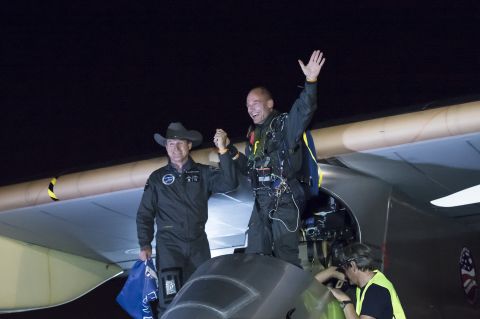 Solar Impulse co-pilots Andre Borschberg, left, and Piccard celebrate completion of the first leg of their American mission on May 3.