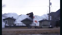 Ice sheets pushed ashore by winds destroyed homes in Manitoba, Canada, over the weekend. Pictured, a house is overcome by the ice sheet on Sunday, May 12.