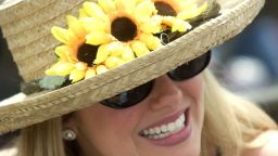 BALTIMORE, : Jaynee Kannan of Centerville, Virgina, wears a hat covered with Lazy Susans as she watches races 15 May 1999 at Pimlico Race track in Baltimore, MD. Today is the running of the 124th Preakness Stakes. (ELECTRONIC IMAGE) AFP PHOTO (Photo credit should read DON EMMERT/AFP/Getty Images) 