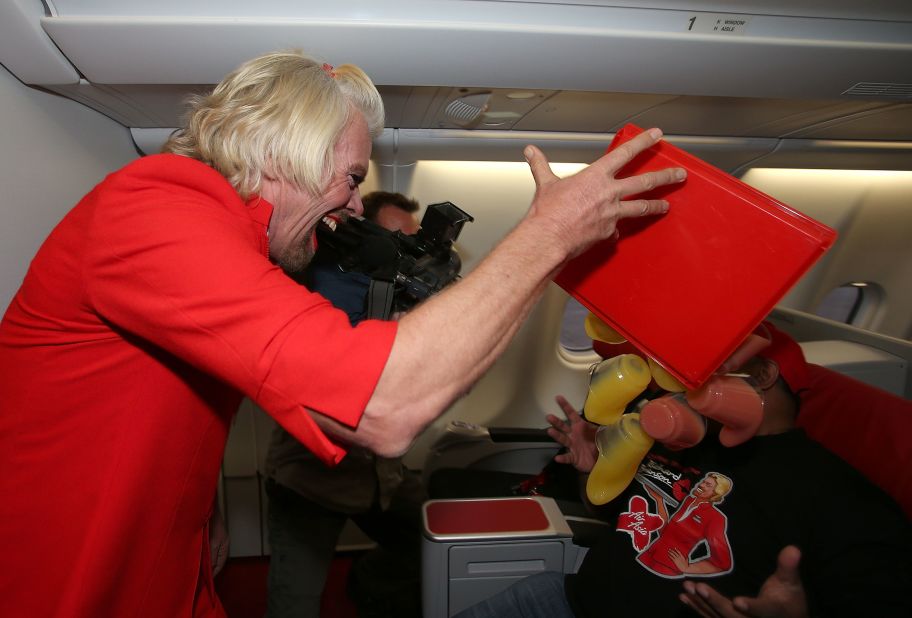 Branson is probably the only flight attendant who can get away with "spilling" drinks on the airline boss and laughing about it.